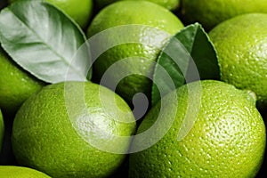 Fresh ripe juicy limes as background