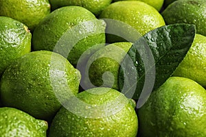 Fresh ripe juicy limes as background