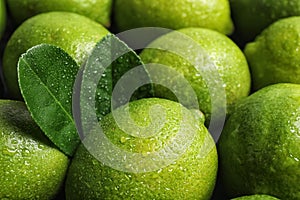 Fresh ripe juicy limes as background