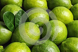 Fresh ripe juicy limes as background