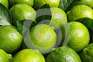 Fresh ripe juicy limes as background