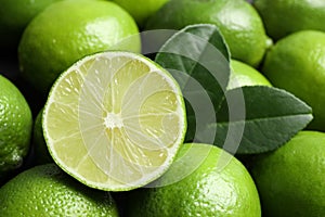 Fresh ripe juicy limes as background, closeup