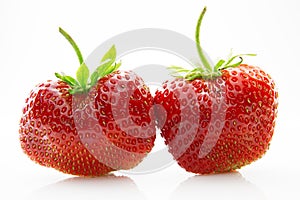 Fresh, ripe, juicy and mouth-watering strawberries with green leaves