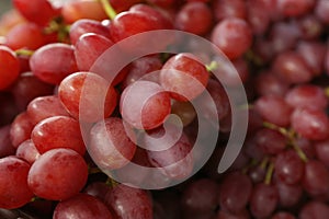 Fresh ripe juicy red grapes as background