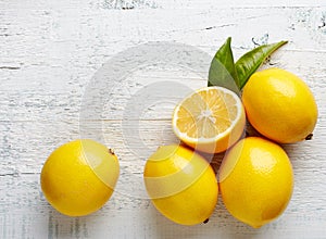 Fresh ripe lemons on wooden table