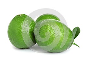 Fresh ripe limes with green leaf isolated