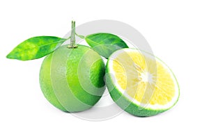 Fresh ripe limes with leaves isolated on white