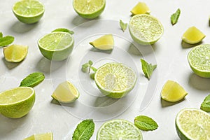 Fresh ripe limes on light background