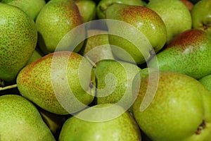 Fresh ripe multi-colored pears in a box