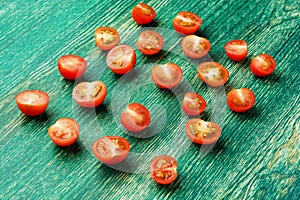 Fresh ripe organic Cherry Tomatoes on green wooden background