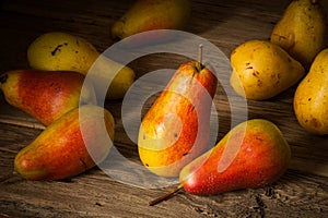 Fresh ripe organic pears on a wooden table