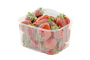 Fresh ripe organic strawberries in transparent plastic retail package. Isolated on white background with clipping path.