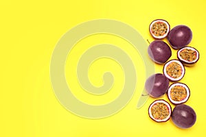 Fresh ripe passion fruits maracuyas on yellow background. Space for text