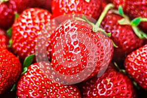 Fresh ripe perfect red strawberry - food frame background, closeup.