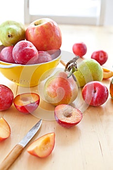 Fresh ripe plums, apples and pears photo