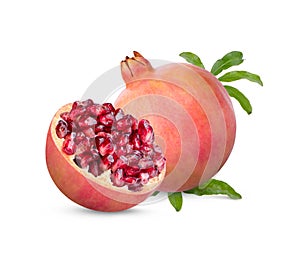 Fresh ripe pomegranate with green leaves isolated on white background