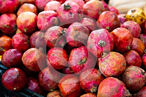 Fresh ripe pomegranates in box for sale