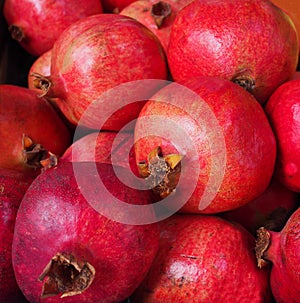 Fresh ripe pomegranates t outdoor farmers market. photo
