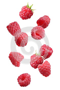 Fresh ripe raspberries falling on background