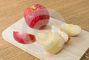 Fresh Ripe Red Apple on A Wooden Cutting Board