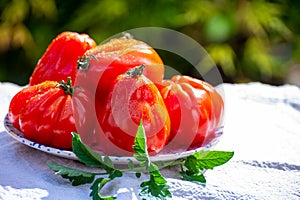 Fresh ripe red beefsteak or coeur de boeuf tomatoes