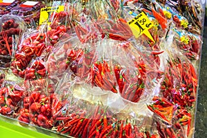 Fresh ripe red habanero and chili pepper in plastic bags