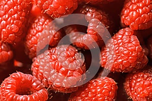 Fresh ripe red raspberries background