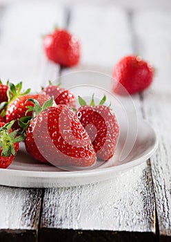 Fresh ripe red strawberries in white