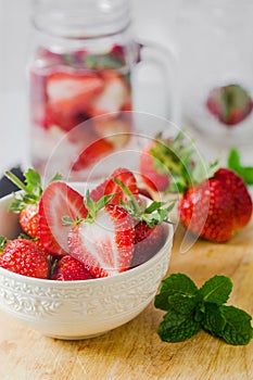 Fresh ripe red strawberries in white bowl