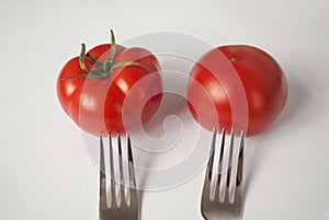 fresh, ripe, red tomatoes on a light background