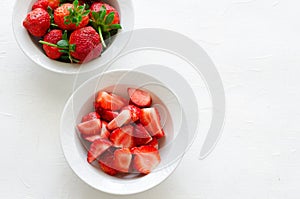 Fresh ripe strawberries in bowl on white background, copy space