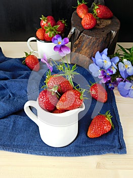 Fresh ripe strawberries in a jug