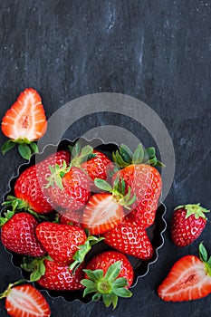 Fresh ripe strawberry on dark background