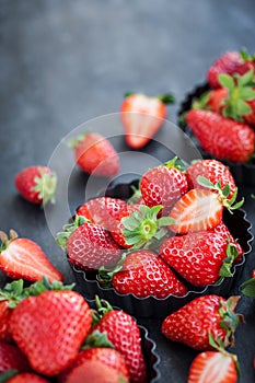 Fresh ripe strawberry on dark background