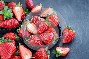 Fresh ripe strawberry on dark background