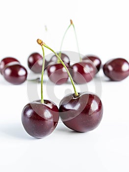 Fresh ripe sweet cherries on a white background