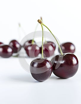 Fresh ripe sweet cherries on a white background