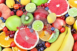 Fresh ripe sweet fruits: apple, orange, grapefruit, qiwi, banana, lime, peach, berries