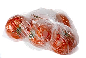 Fresh ripe tomatoes in the pack isolated