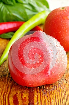 Fresh ripe tomatoes in a spray of water