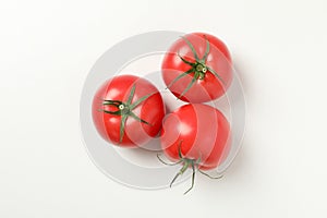 Fresh ripe tomatoes on white background top view