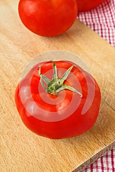 Fresh ripe tomatoes on wood table