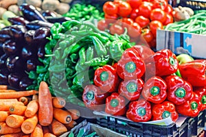 Fresh ripe vegetables on shelves in market
