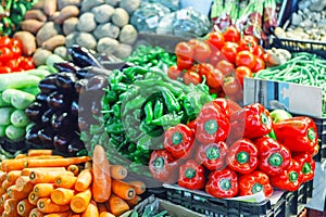 Fresh ripe vegetables on shelves in market