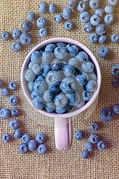 Fresh ripe whortleberries on table. Flat lay