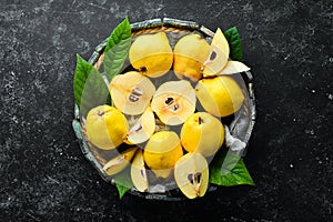 Fresh ripe yellow quince. Fruits in a wooden box.