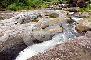 Fresh river water running over rocks as seen at a remote location in the Windward Islands