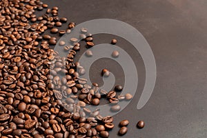 Fresh roasted coffee beans background. Selective focus. Copy space