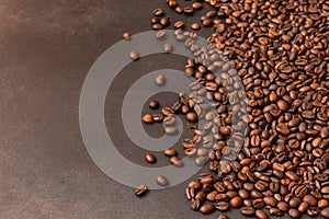 Fresh roasted coffee beans background. Selective focus. Copy space