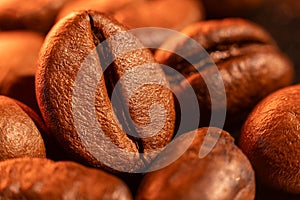 Fresh roasted coffee beans heap with a colorful background
